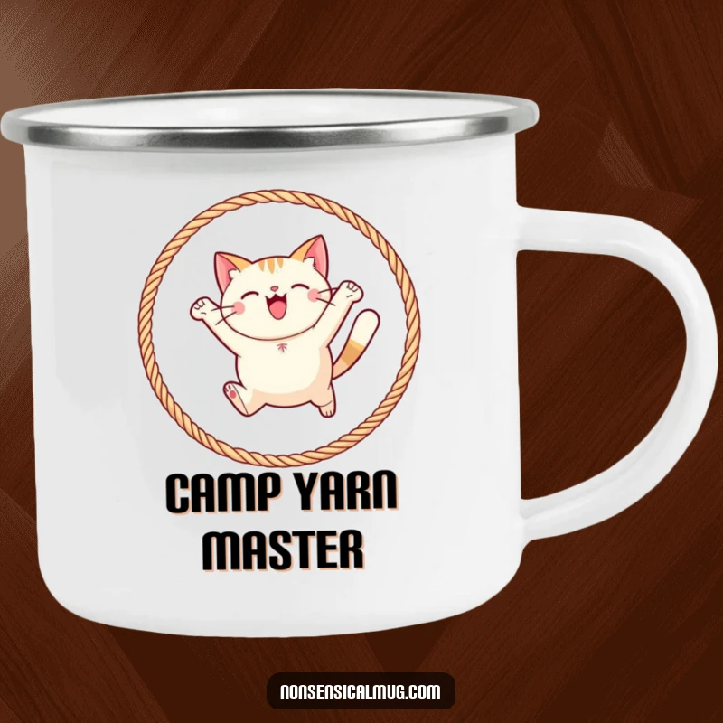 Funny round cat joyfully leaping through a hoop of yarn on a camping mug, for enjoying drinks with outdoor playfulness.