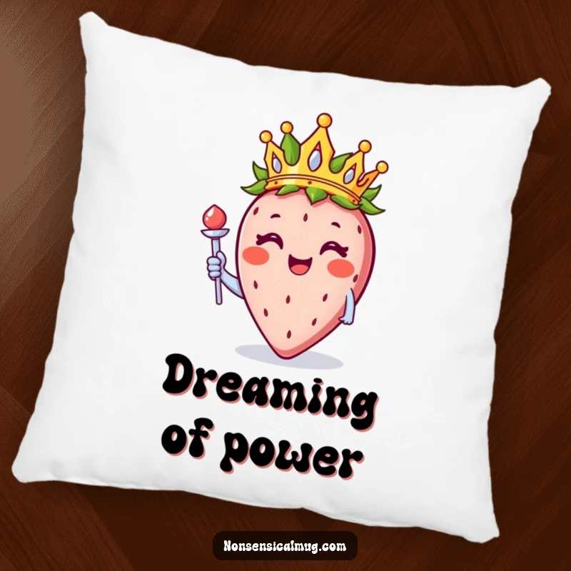 Funny smiling strawberry wearing a crown and holding a scepter, featured on a soft pillow for a whimsical home accent.