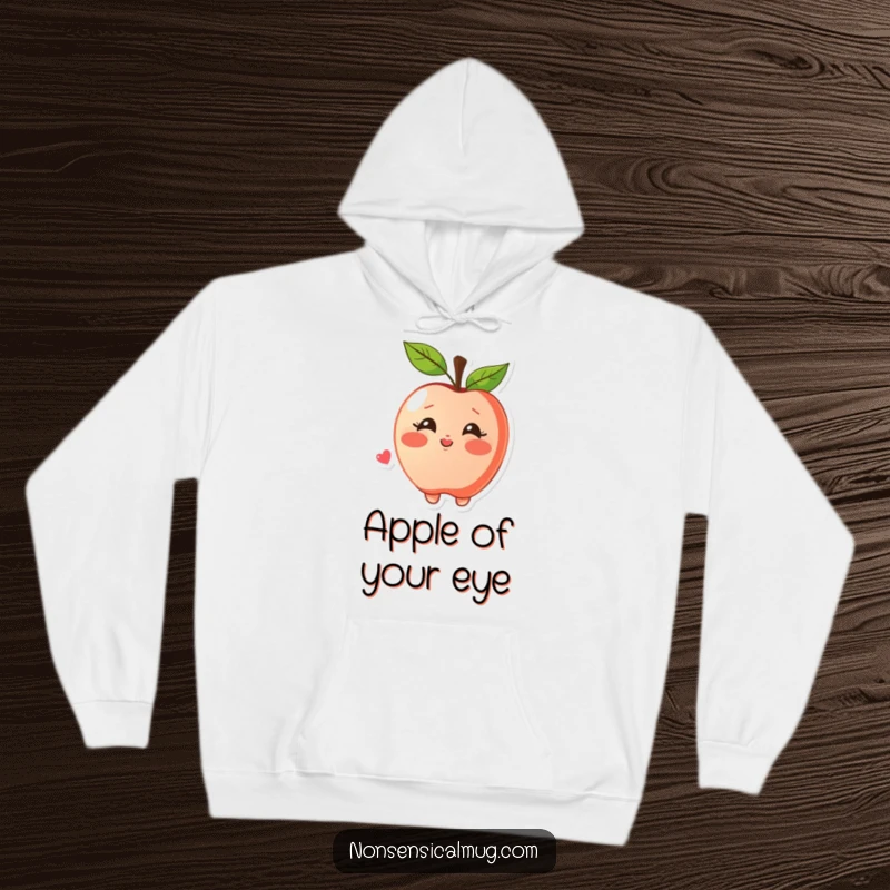 Funny hoodie featuring a blushing apple character joyfully blowing a kiss, perfect for spreading warmth and affection.