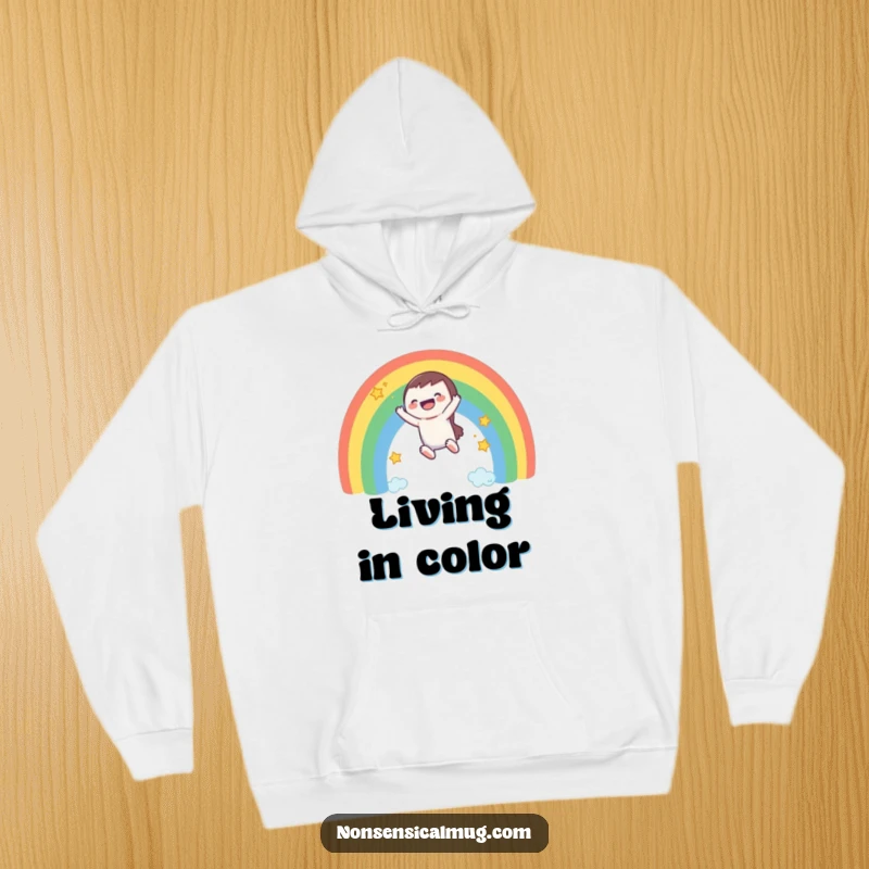 Funny hoodie: a happy character slides down a magical rainbow, with stars twinkling in the background.