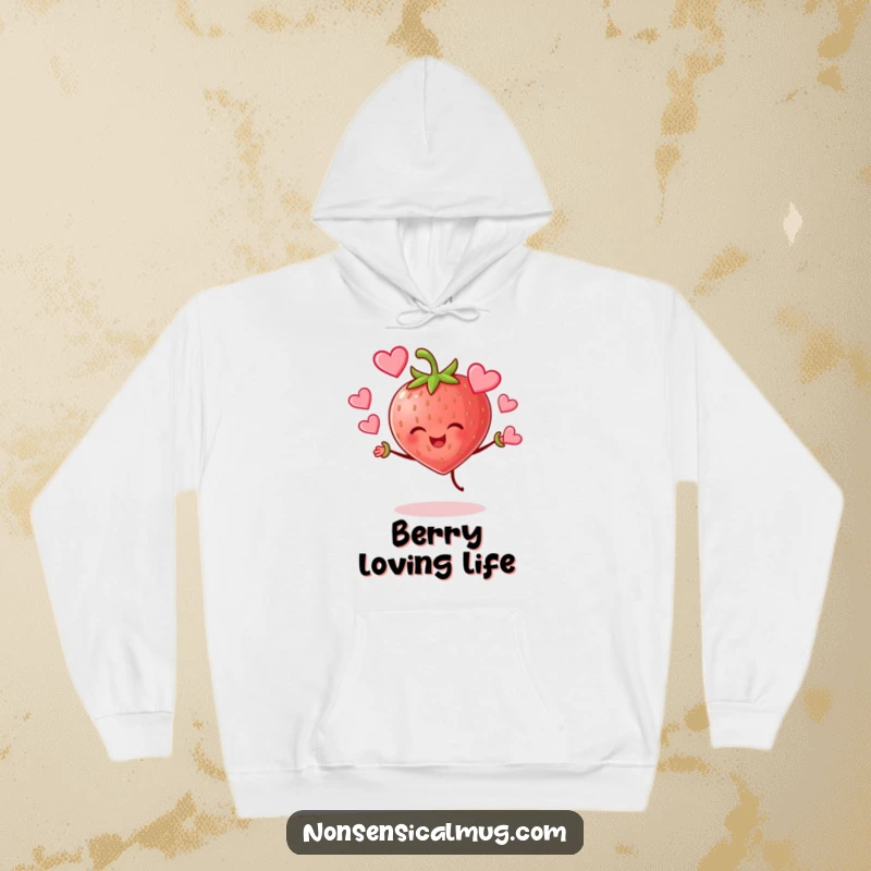 Funny cheerful strawberry character joyfully juggling hearts on a warm hoodie, radiating sweet and funny love.