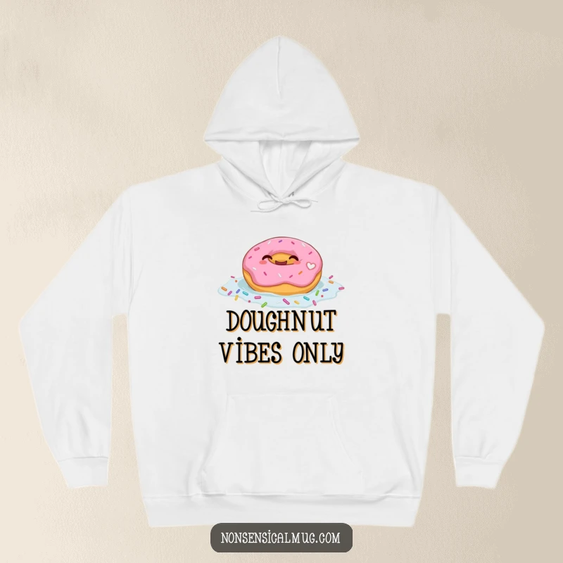 Funny hoodie featuring a giggling donut character joyfully floating in a sea of colorful sprinkles, exuding happiness.