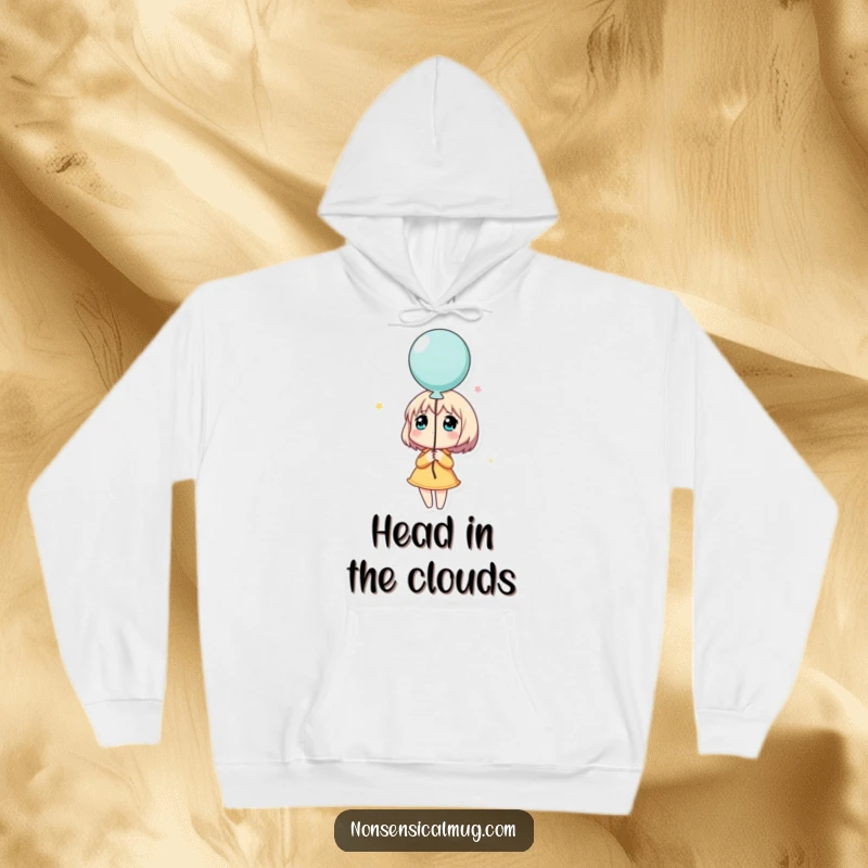 Funny hoodie showcasing a character holding a balloon and looking dreamily upwards, a cozy and whimsical piece for contemplation.