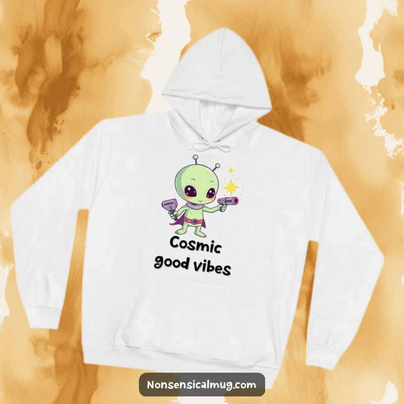 Funny Kawaii Alien Sparkle Ray Gun Hoodie: A cute alien fires a ray gun emitting bright sparkles, offering warm, cosmic vibes.