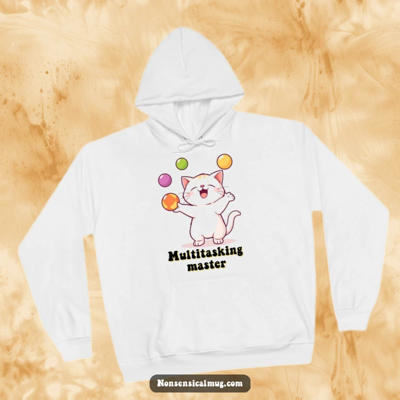 Funny Kawaii Cat Hoodie: A cute kawaii cat is depicted in the act of skillfully juggling three colorful balls.