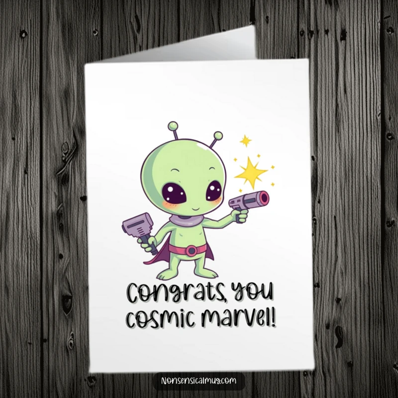 Free Printable congratulations card featuring a kawaii alien aiming a ray gun that emits a shower of bright sparkles.