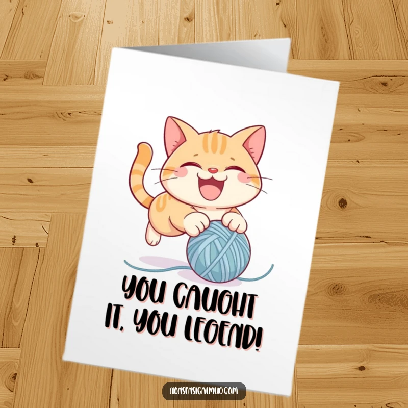 Funny Free Printable Cat Congratulations Card featuring a mischievous cat pouncing on a yarn ball, celebrating victory with glee.