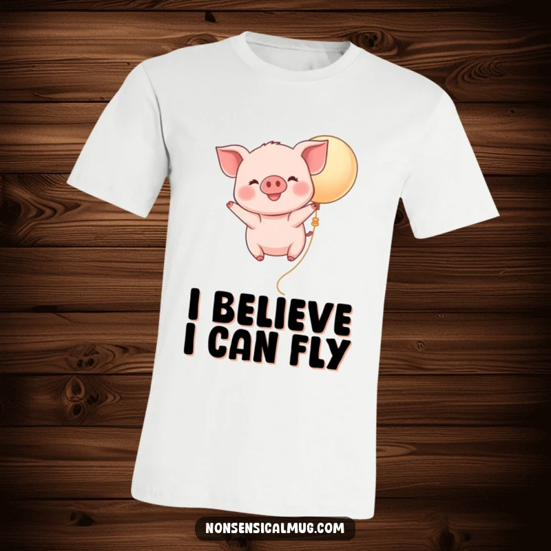 Funny Kawaii Piglet Balloon T-Shirt: A happy, smiling piglet floats skyward on a buoyant balloon, expressing pure, joyful freedom.