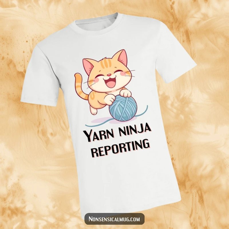 Funny t-shirt depicting a mischievous cat character in mid-pounce on a bouncy ball of yarn, full of playful energy and humor.