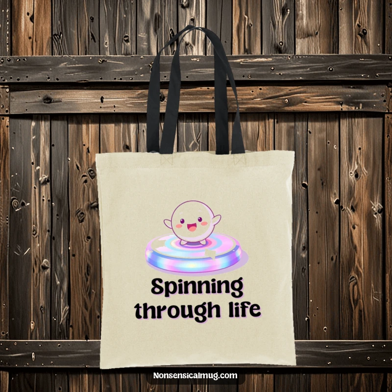 Funny Tote Bag: A playful, spherical character gleefully spinning on a vibrant, iridescent platform, great for carrying essentials.